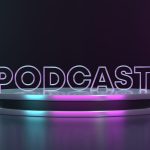 Podcast sign that is purple and blue sitting on a table